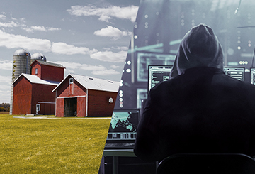Auf der einen Seite ein Bauernhof auf der anderen ein Hacker